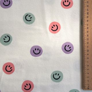 Bawełniana tkanina FLANNEL Happy faces off white lilac